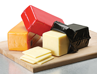 Packaged cheeses using high barrier shrink bags